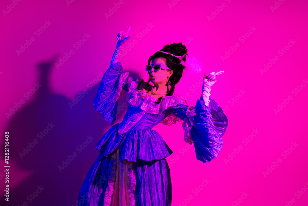 Young elegant woman in historic costume illuminated by neon pink and violet lighting in a baroque-inspired fashion theme Young elegant woman in historic costume illuminated by neon pink and violet lighting in a baroque-inspired fashion theme