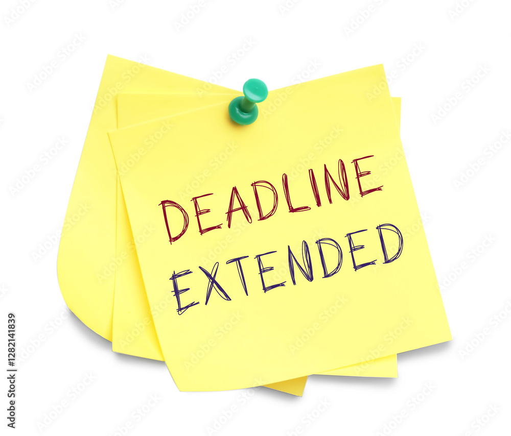 Paper note with text Deadline Extended attached to white wall Paper note with text Deadline Extended attached to white wall