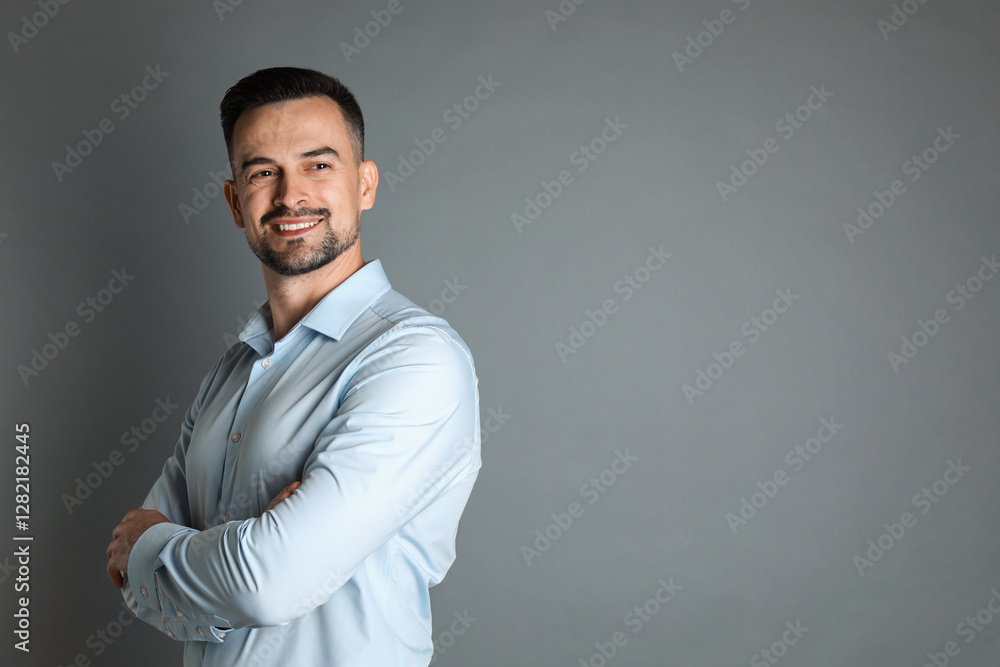 Portrait of handsome middle aged man on grey background, space for text Portrait of handsome middle aged man on grey background, space for text