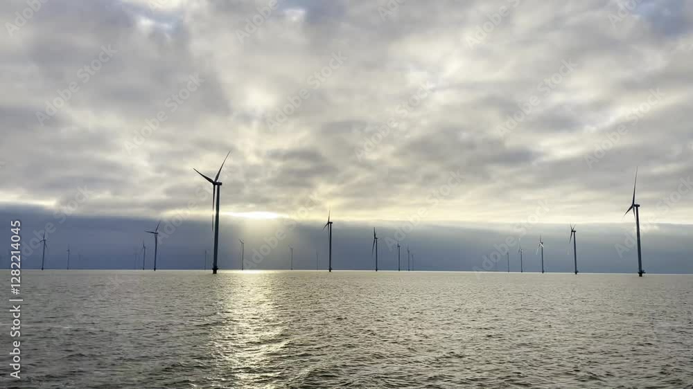 Windmill park at the IJsselmeer in The Netherlands. Windmill park at the IJsselmeer in The Netherlands.