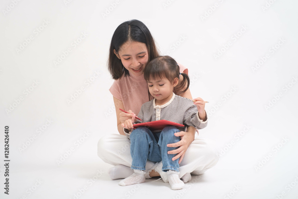 A cheerful mother and daughter enjoy quality time, bonding over a digital tablet in a bright, minimalistic setting, enhancing learning and connection. A cheerful mother and daughter enjoy quality time, bonding over a digital tablet in a bright, minimalistic setting, enhancing learning and connection.