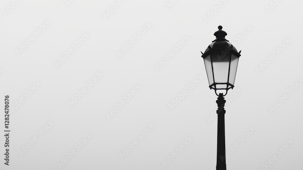 Foggy city street lamp, minimalist design, atmospheric background, ideal for website header Foggy city street lamp, minimalist design, atmospheric background, ideal for website header