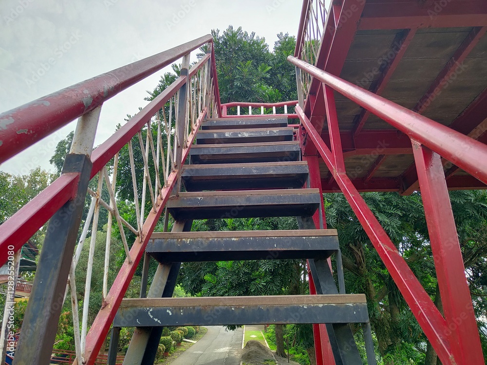 CONSTRUCTION OF AN IRON AND WOODEN STAIR VIEWPOINT WHICH IS AN ATTRACTION FOR TOURISTS TO ENJOY THE VIEW CONSTRUCTION OF AN IRON AND WOODEN STAIR VIEWPOINT WHICH IS AN ATTRACTION FOR TOURISTS TO ENJOY THE VIEW
