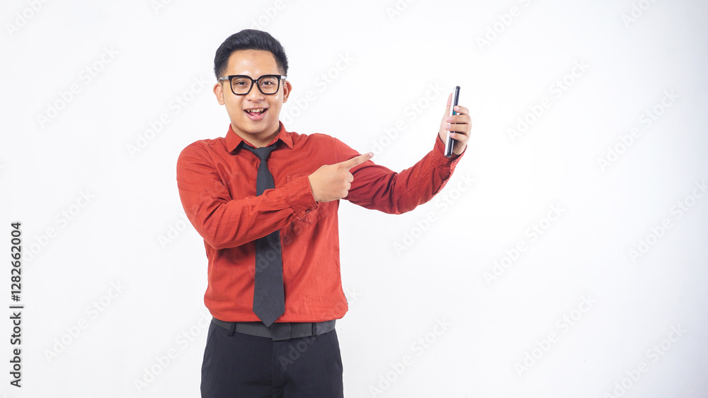 Portrait of Smiling Asian Male Office Worker Pointing at Mobile Phone Mock Up Isolated on White Background Portrait of Smiling Asian Male Office Worker Pointing at Mobile Phone Mock Up Isolated on White Background