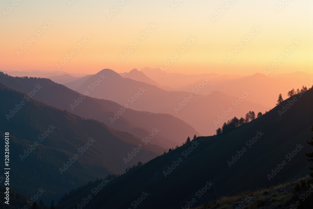Fototapeta premium Breathtaking Sunset Over Majestic Mountains: A Serene Landscape of Peaks and Valleys bathed in Warm Colors at Dusk in a Scenic Natural Environment