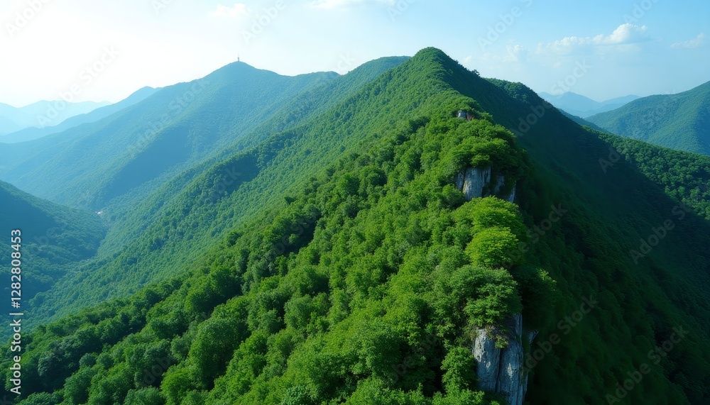 Fototapeta premium Lush Green Mountain Ridges with Distant Figure on Peak