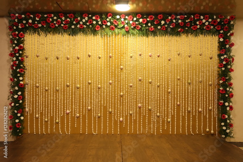 simple yellow theme stage decor designed with jasmine and lotus flowers