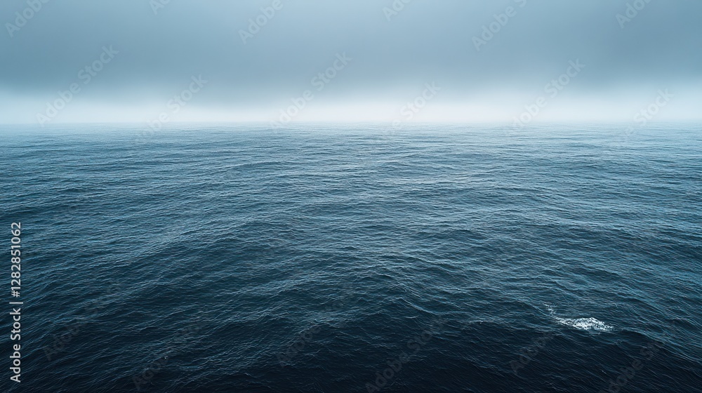 Foggy ocean, grey sky, sea view, calm waves, travel backdrop Foggy ocean, grey sky, sea view, calm waves, travel backdrop