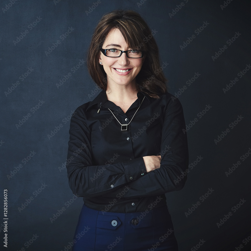 Portrait, arms folded and happy business woman in studio, compliance officer or policy advisor. Glasses, entrepreneur and confident person, worker and regulatory agent on dark background in Italy Portrait, arms folded and happy business woman in studio, compliance officer or policy advisor. Glasses, entrepreneur and confident person, worker and regulatory agent on dark background in Italy