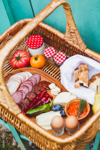 Rustic Picnic Basket with Fresh Produce
