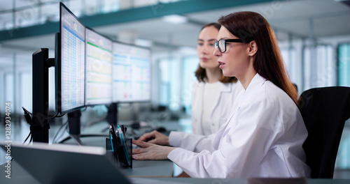 young female medical coder maintaining billing spreadsheets photo