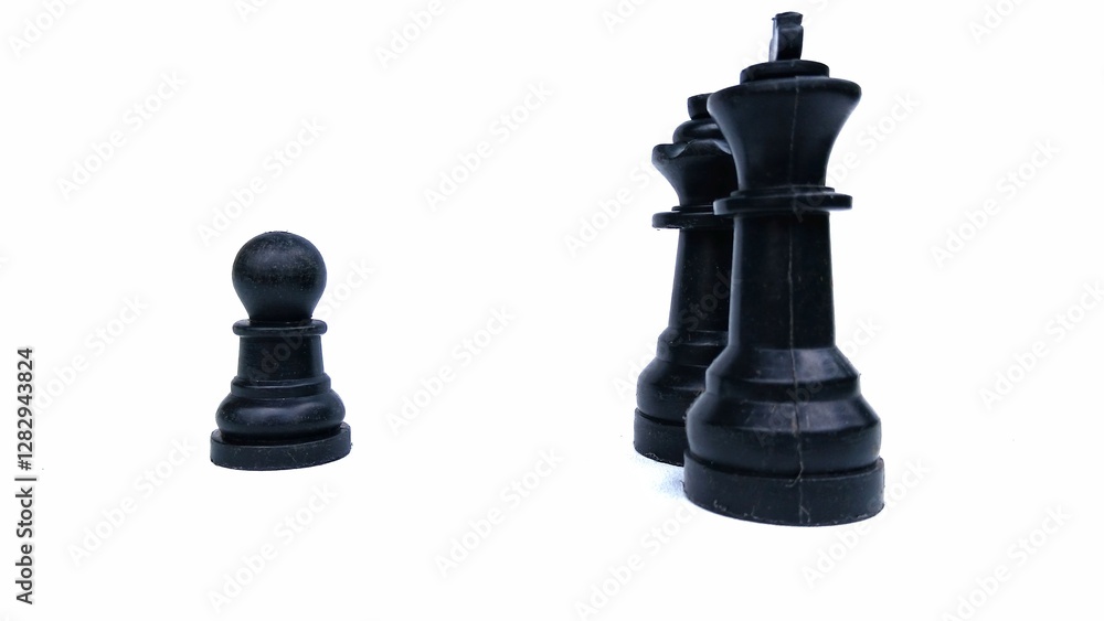 Motivational business and management concept. Black chess pieces placed on a white background. Motivational business and management concept. Black chess pieces placed on a white background.