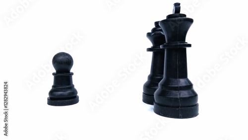 Motivational business and management concept. Black chess pieces placed on a white background.