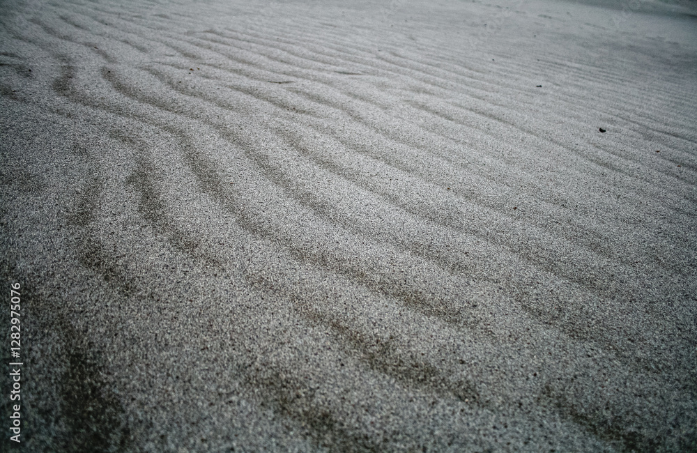 Abstract Close-Up of Textured Sand with Fine Ripples in Gray Tones