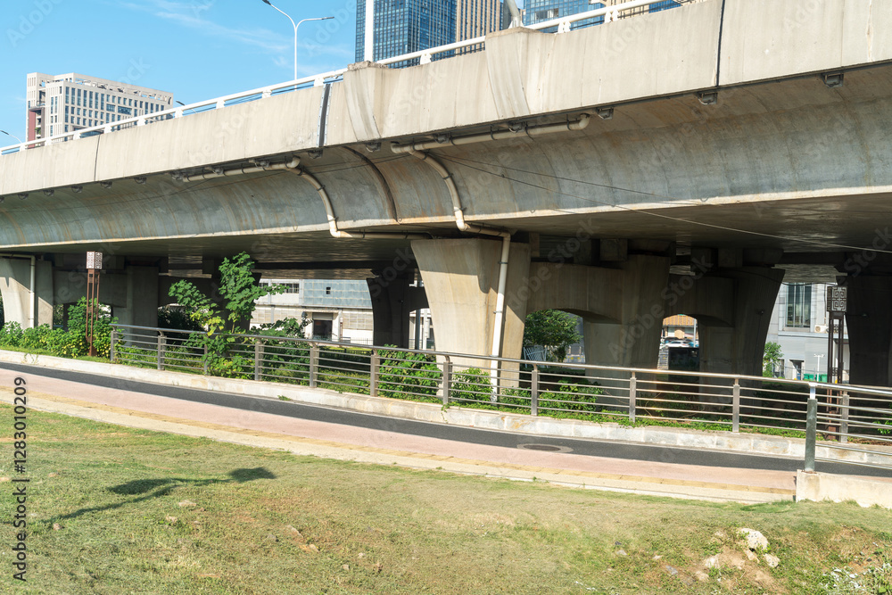 Concrete structure and asphalt road space under the overpass in the city Concrete structure and asphalt road space under the overpass in the city