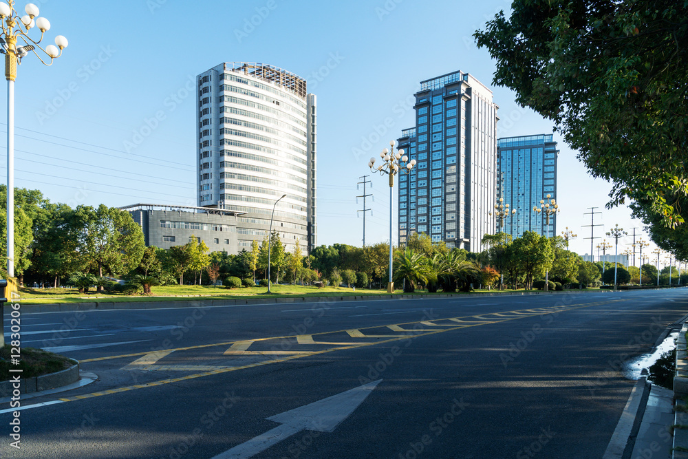 Empty urban road and buildings in the city Empty urban road and buildings in the city