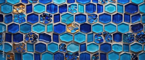 Blue glass mosaic tile pattern featuring hexagonal shapes in various shades of blue with a few crushed pieces for texture. photo