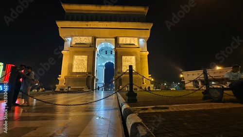 beautiful view of the Simpang Lima Gumul Monument, the city of Kediri at night. East Java Indonesia which has a monument that resembles the Arc De Triomphe in France. February 22 2025 photo