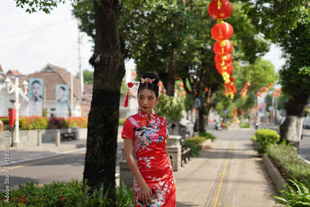 Obraz premium Woman in Red Cheongsam Surrounded by Lanterns