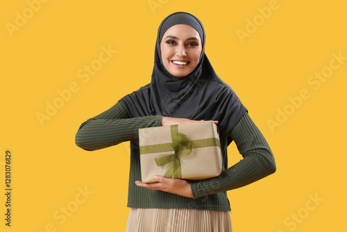 Young Muslim woman with gif...