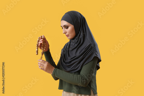 Young Muslim woman with pra...