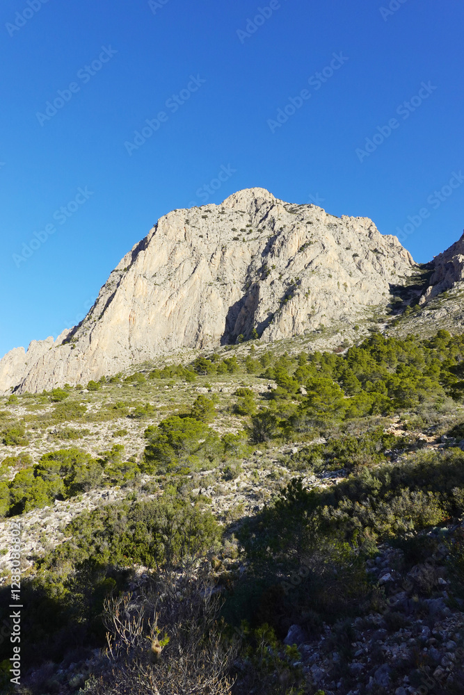 The mountain panorama opening from the hiking path to Puig Ca Campana, Finestrat, Spain The mountain panorama opening from the hiking path to Puig Ca Campana, Finestrat, Spain
