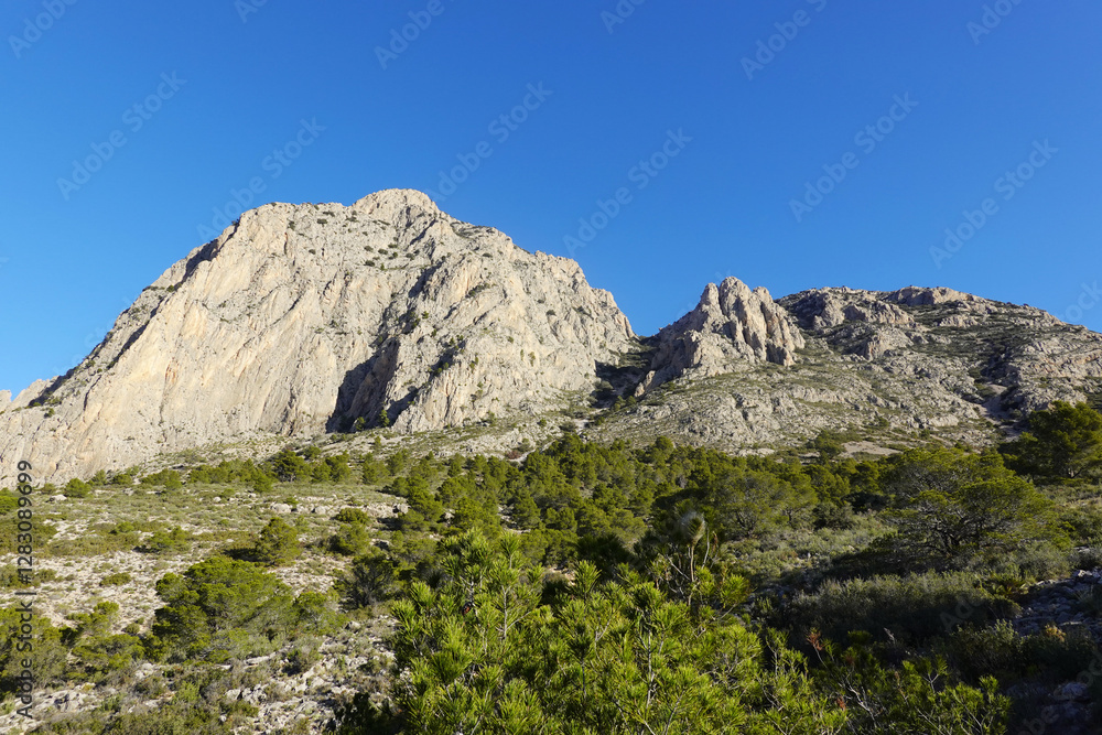 The mountain panorama opening from the hiking path to Puig Ca Campana, Finestrat, Spain The mountain panorama opening from the hiking path to Puig Ca Campana, Finestrat, Spain