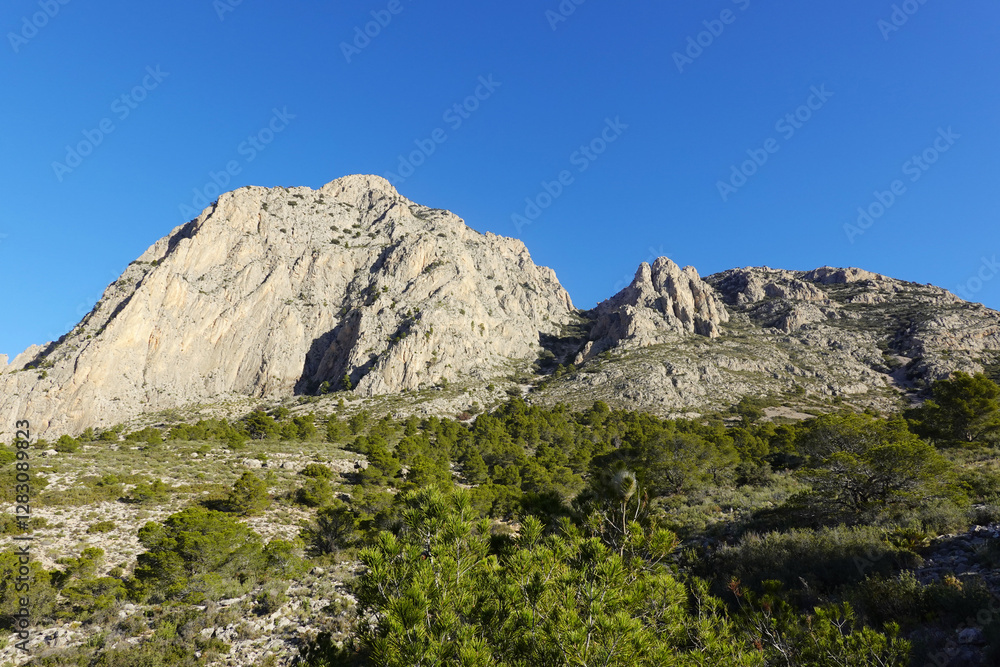 The mountain panorama opening from the hiking path to Puig Ca Campana, Finestrat, Spain The mountain panorama opening from the hiking path to Puig Ca Campana, Finestrat, Spain