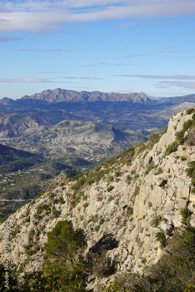 The mountain panorama opening from the hiking path to Puig Ca Campana, Finestrat, Spain The mountain panorama opening from the hiking path to Puig Ca Campana, Finestrat, Spain