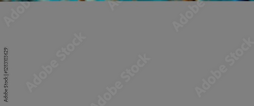 Blue and white decorated eggs in an egg carton on a wooden table with blue decorative petals and a rustic background.