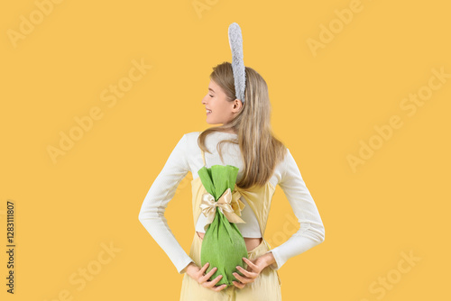 Young woman in bunny ears w...