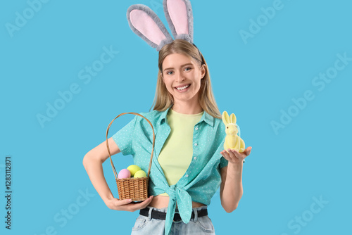 Young woman in bunny ears w...