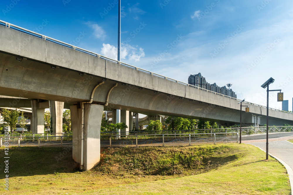 Concrete structure and asphalt road space under the overpass in the city Concrete structure and asphalt road space under the overpass in the city