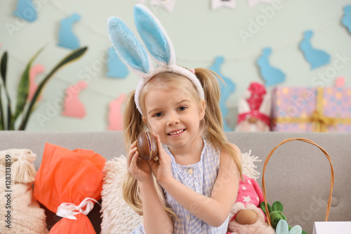 Cute little girl in bunny e...