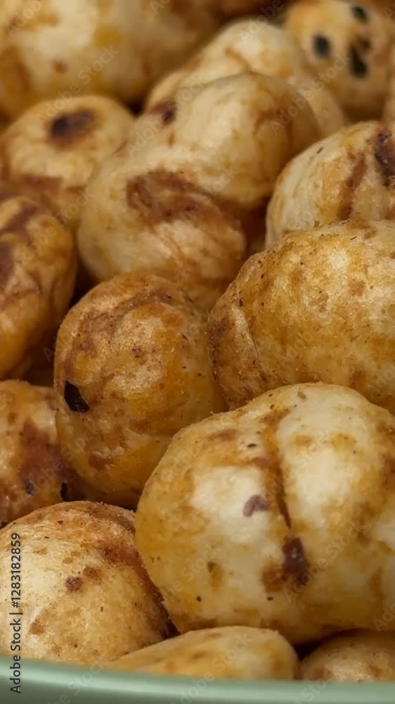 4k HDR Video of Piri-Piri flavor lotus seeds or makhana, Lotus seeds isolated, puffed Lotus seed isolated. 4k HDR Video of Piri-Piri flavor lotus seeds or makhana, Lotus seeds isolated, puffed Lotus seed isolated.
