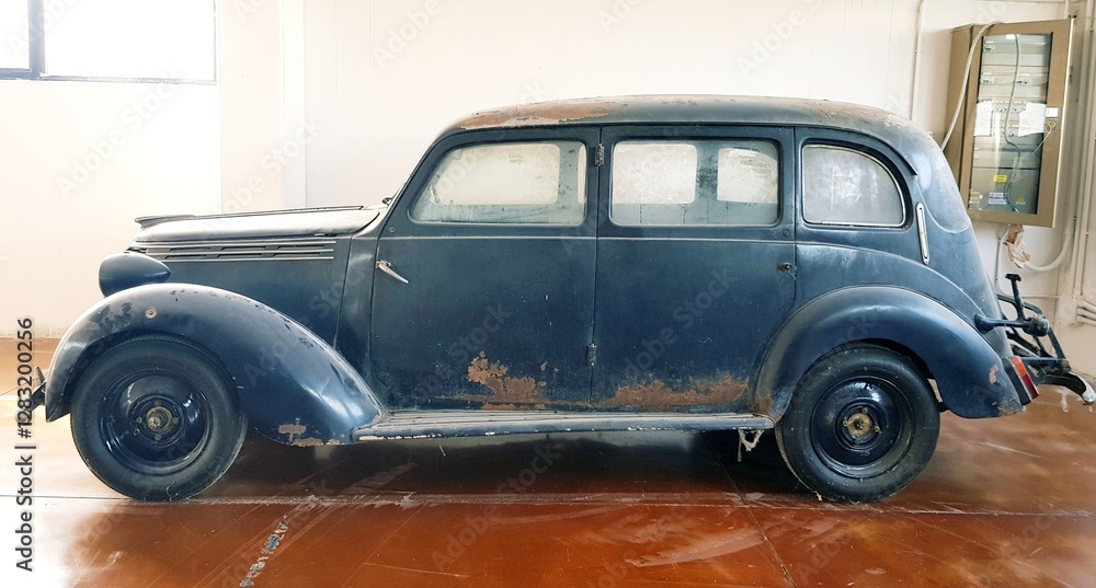 Abandoned car in the old house, retro car in the old house