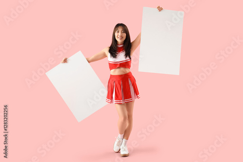 Young Asian cheerleader wit...