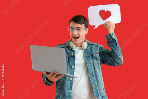 Young man with laptop and s...