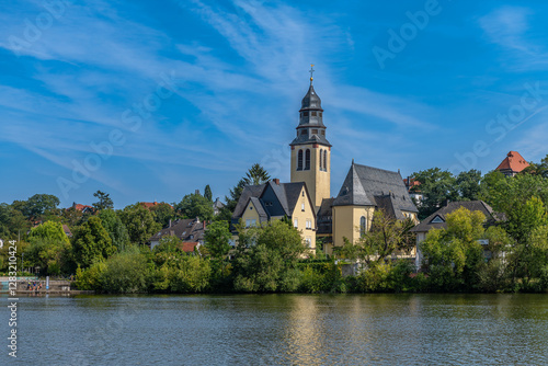 The Main river bank and Sacred Heart Church, Kelsterbach am Main, Hesse, Germany