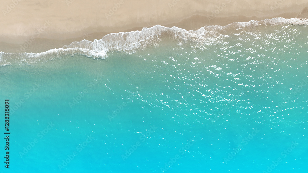 Tropical Beach with the soft wave water of the sea on the sandy beach background as texture with splashes Tropical Beach with the soft wave water of the sea on the sandy beach background as texture with splashes