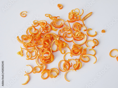 Orange peel forming a pile on white background