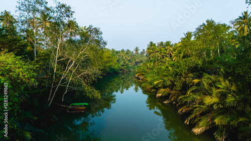 Serene waters reflect lush greenery in Chumphon Thailand on a tranquil morning