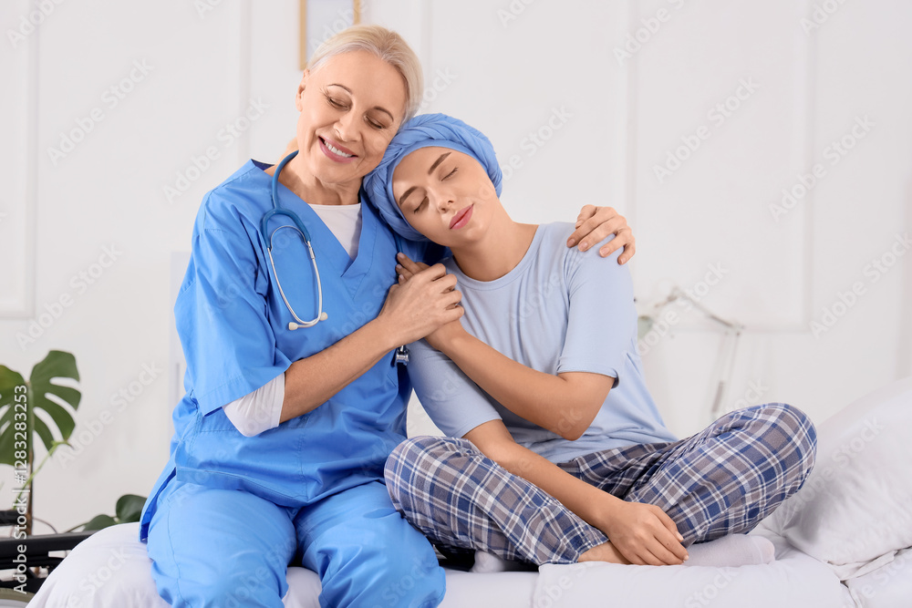 Young woman after chemotherapy with nurse hugging in hospital room. Brain cancer concept Young woman after chemotherapy with nurse hugging in hospital room. Brain cancer concept