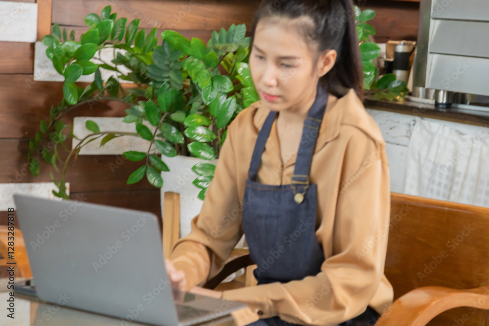 Attractive barista female or employee concentrate on stacks of tax declaration bills, restaurant owner using laptop for bookkeeping control payment, multitask small business lifestyle financial budget Attractive barista female or employee concentrate on stacks of tax declaration bills, restaurant owner using laptop for bookkeeping control payment, multitask small business lifestyle financial budget