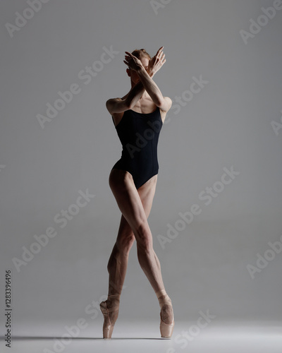 Wallpaper Mural Young beautiful ballerina is posing in studio Torontodigital.ca