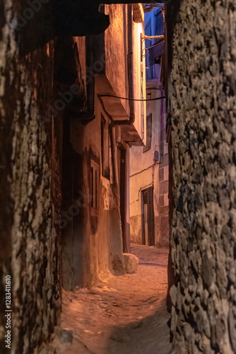Beautiful nightfall view of a typical and narrow street in the Jewish Quarter of Hervás at night,  one of the best preserved in Spain, an Ambroz Valley village at Caceres, Extremadura, Spain. 