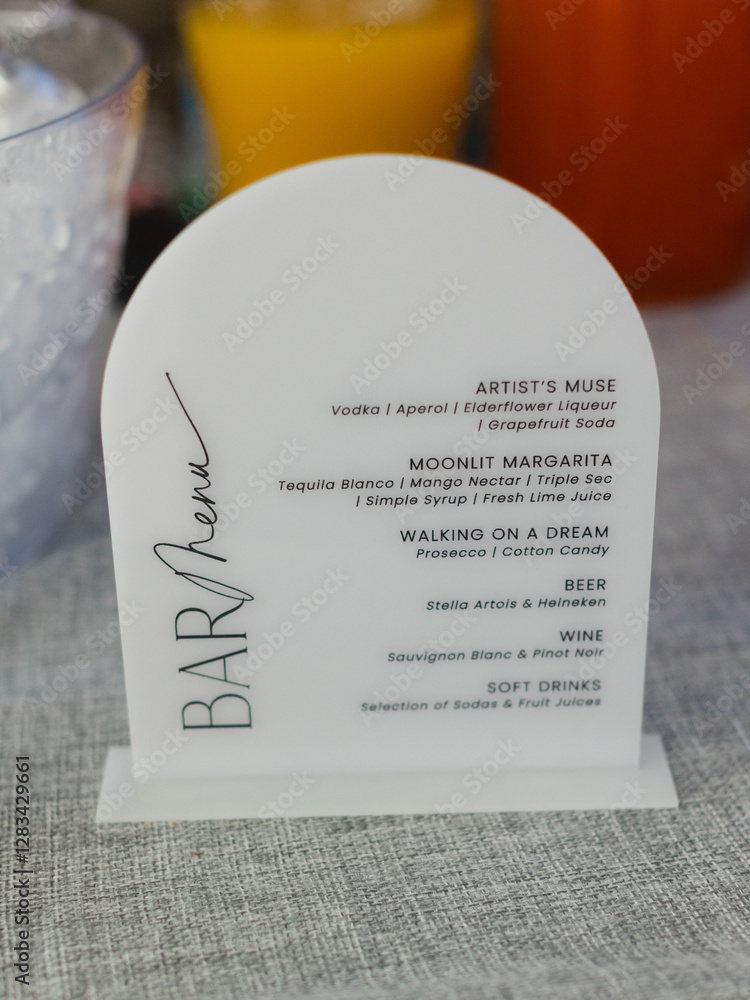 Fototapeta premium Unique bar menu showcasing creative cocktails at a stylish event during daylight hours