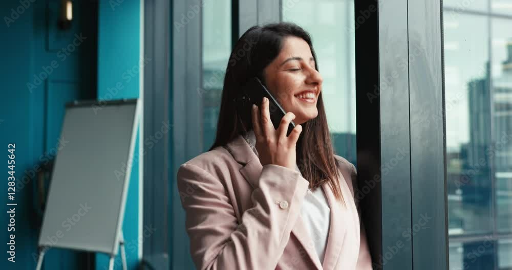 Business woman, window and talking with phone call for discussion, conversation or corporate proposal at office. Female person, financial advisor or agent with mobile smartphone for finance advice Business woman, window and talking with phone call for discussion, conversation or corporate proposal at office. Female person, financial advisor or agent with mobile smartphone for finance advice