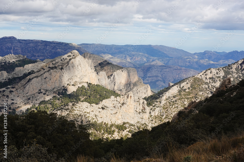 The mountain panorama opening from the hiking path to pick Puig Campana, Finestrat, Benidorm, Spain The mountain panorama opening from the hiking path to pick Puig Campana, Finestrat, Benidorm, Spain