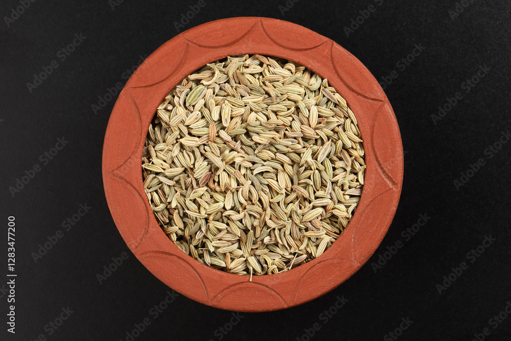 dried herb, fennel seeds spices in terracotta bowl
dried herb, fennel seeds spices in terracotta bowl